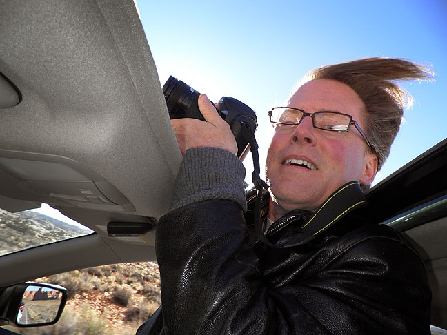 Overwhelmed by the beauty of Arches National Park, Robert shoots through my open sunroof.