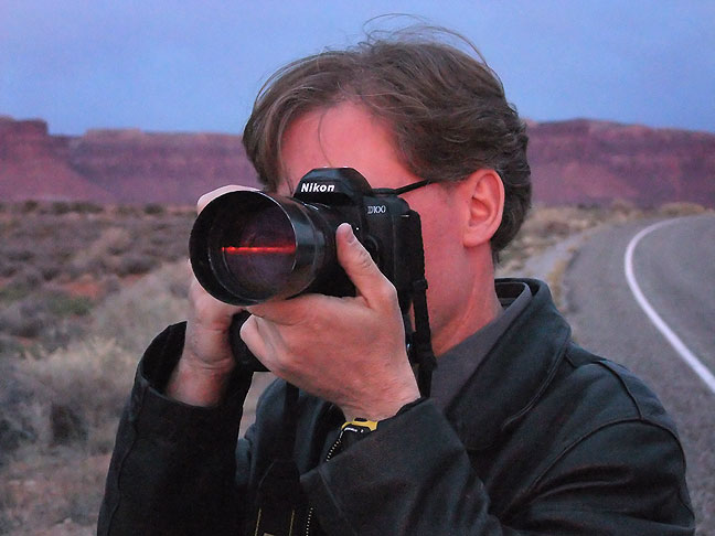 Robert points his camera at a band of brilliant color during sunset as we exit Canyonlands.