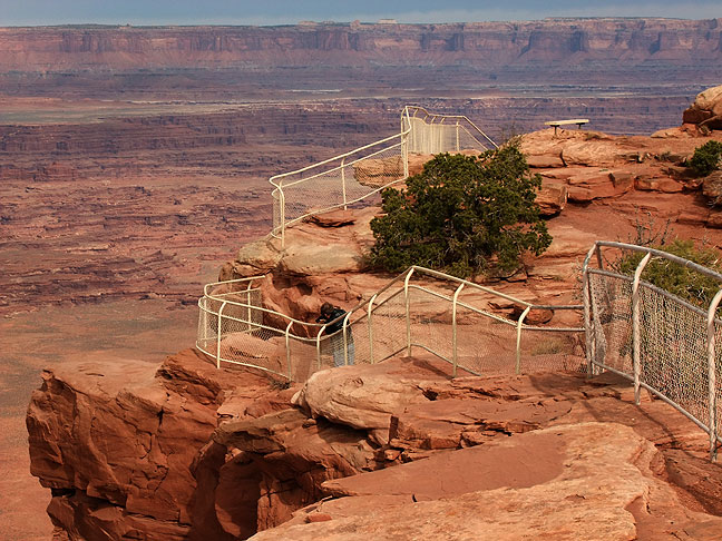 Robert moves along the winding fence at the Needles Overlook, Canyon Rims Recreation Area, Utah.