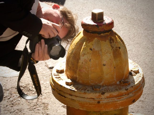 Robert photographs a fire hydrant in Santa Fe.