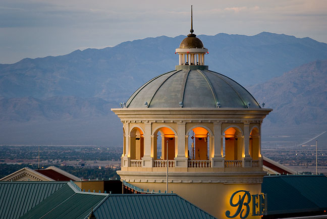 The crown of the Bellagio Hotel is set against the Quartzite Mountains at dusk.