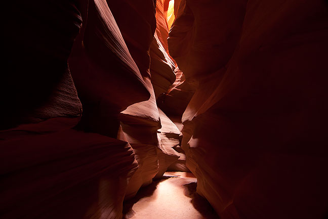 Only in rare moments like this is the floor of Antelope Canyon clear of people and tripod legs, allowing a clear shot. If and when it does happen, the beauty of the place is very powerful.
