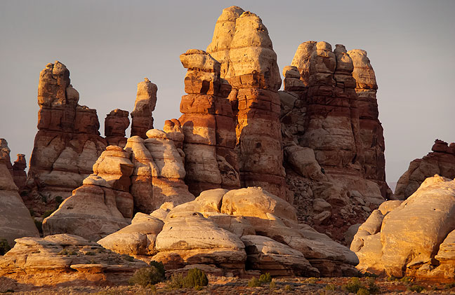 The Doll House consists of the same Cedar Mesa Sandstone spires as are common in The Needles District of Canyonlands directly across the Colorado River.