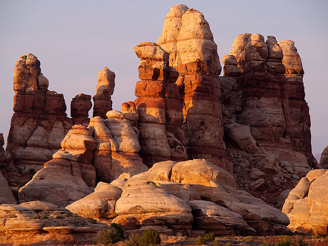 The Doll House, a collection of Cedar Mesa Sandstone spires, stands at the end of the long, challenging road in the heart of one of America's wildest places, The Maze District of Utah's Canyonlands National Park.