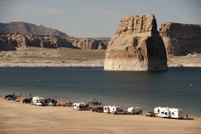 On my way back to Page, Arizona, I stopped at Lake Powell's Lone Rock site. Campers and RVs line the shore.