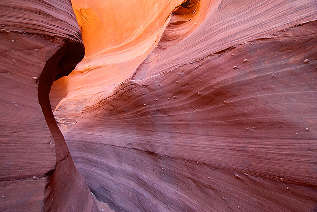 Elegant, delicate colors swirl in the depths of Waterholes Canyon south of Page, Arizona.