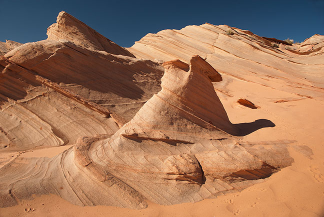 The rim above Waterholes Canyon is also beautiful, with fields of elegant sandstone formations like this one.