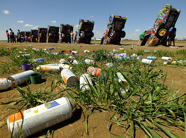 Stanley Marsh's Cadillac Ranch in Amarillo, Texas, was as crowded as I have ever seen it, and hundreds of empty paint cans were strewn in the field surrounding the cars.
