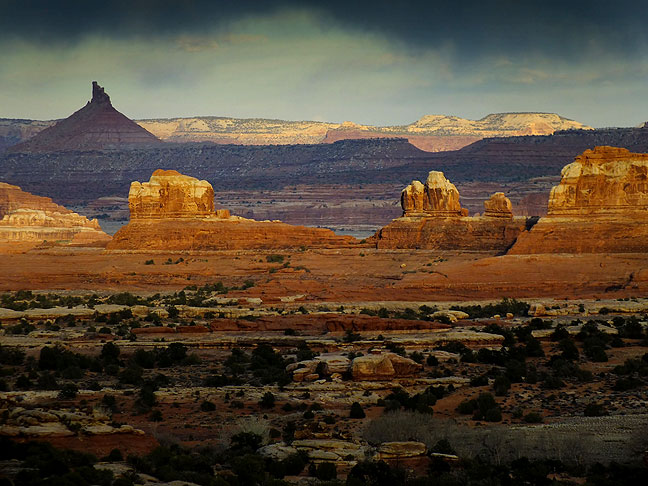Last light graces Wooden Shoe Butte and Sixshooter Peak at Canyonlands National Park, Utah.
