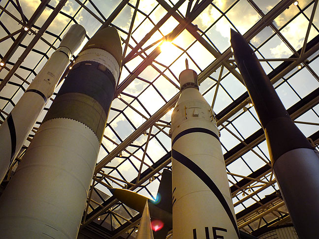 Various rockets stand on display at the Air and Space Museum.