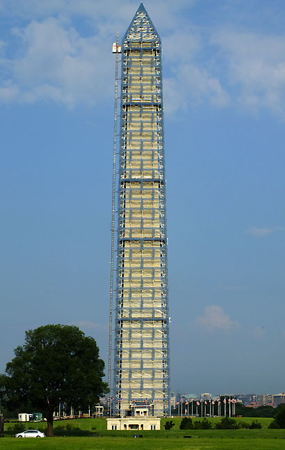 The Washington Monument wears a scaffolding for earthquake repairs.