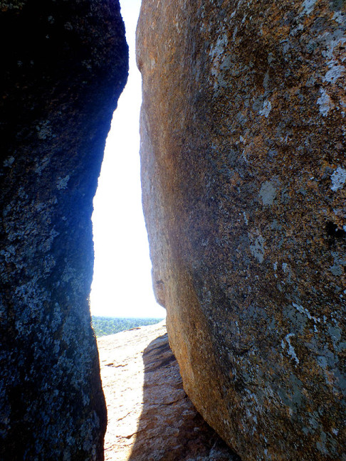 Granite boulders form cracks large enough for an adult to traverse.