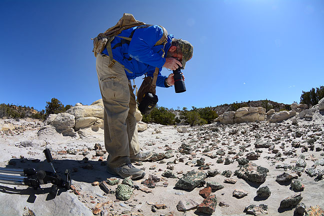 Looking a bit like an astronaut photographing a distant planet, Greg makes macro images of the geology of Penistaja.