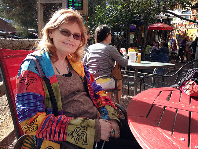 Abby smiles at an outdoor café, The Hollar, in Madrid, New Mexico. "I could live here," she said.