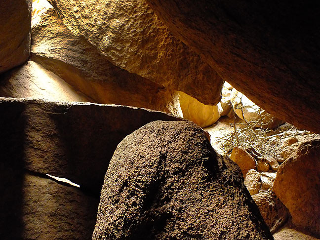 A large boulder field forms a network of cave-like structures near the north end of the Charon's Garden trail.