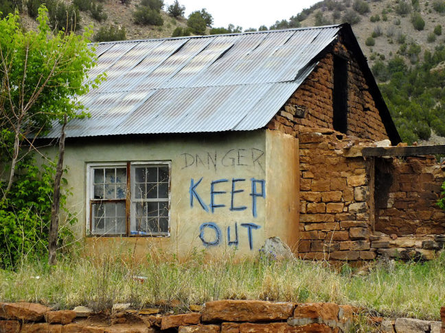 I saw several ruins that were marked in this fashion. I don't know if "Keep Out" is a warning of concern for the safety of trespassers, or an expression of privacy.