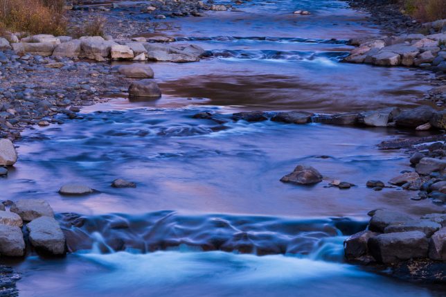 The San Juan River in Pagosa Springs, Colorado takes on a deep blue-purple hue in this 30-second exposure made right after dusk.