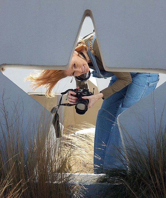 Abby holds her Nikon D70S as she smiles for me at a rest stop in the Texas Panhandle.