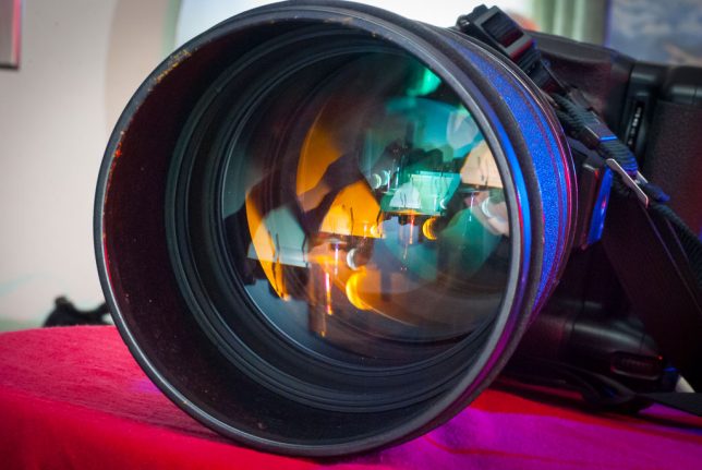 The front element of the 200mm f/2.0 is 100mm across, about four inches. In addition to being heavy, this much reflective surface is prone to flare and ghosting, so the lens has a large, built-in hood.