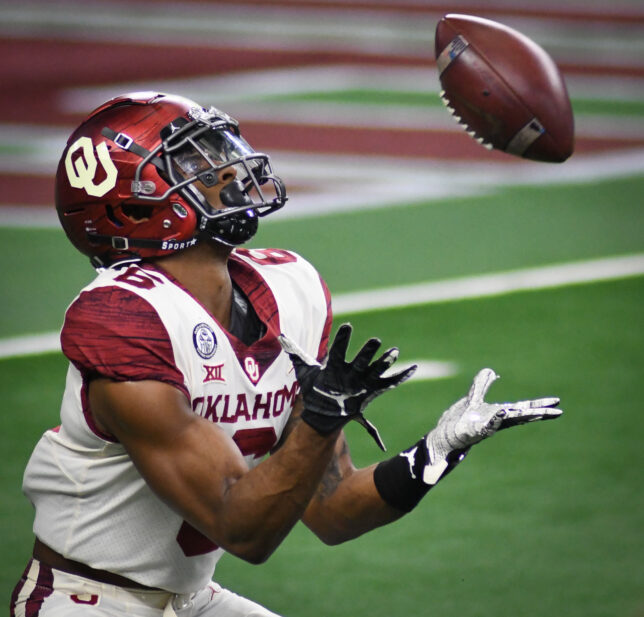 Here is a nice tight crop from Saturday's action at the Big 12 Championship. My 300mm f/2.8 is sharp and capable, but my 300mm f/4 is even sharper, and faster-focusing.