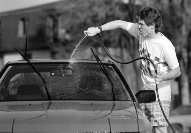 Scott AndersEn washes his car at his suburban Chicago home in 1987.
