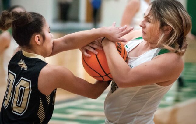 The Allen Lady Mustangs and the Stonewall Lady Longhorns tangle in a game last week in Stonewall. As you can see, the competition can get pretty physical.
