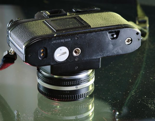 The baseplate of the Nikon EM shows where the MD-E motor drive would attach.