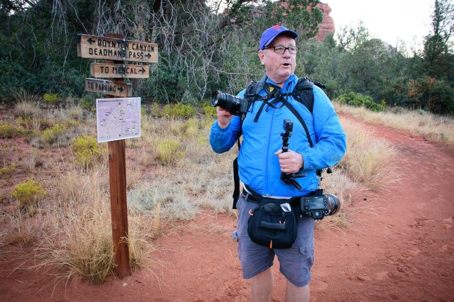 Scott holds a camera at the Boynton Canyon trail head near Sedona, Arizona.