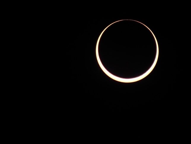 This is a frame just as totality occurred during the October 2023 annular solar eclipse. During such events, the moon doesn't completely block the sun because the moon's orbit isn't a perfect circle, so it is slightly farther away than during a total eclipse.