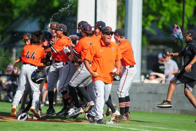 Preston baseball teams members and coaches go wild after a single and an error allowed them to score the winning run in a first-round playoff game last week in Shawnee.