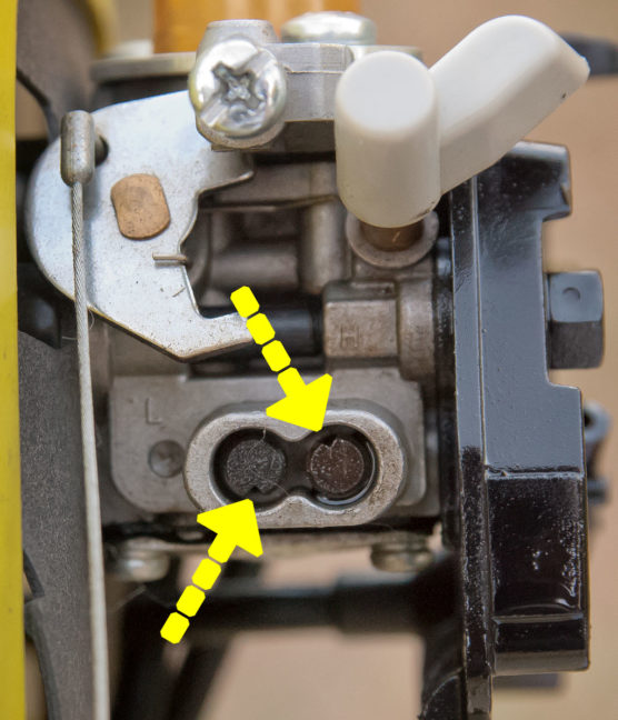 This is a macro image of the Ryobi C430 string trimmer's throttle adjustment. The notches in the knobs are so small I didn't notice them until I looked at this image. Even after seeing them, it was very difficult to adjust them.