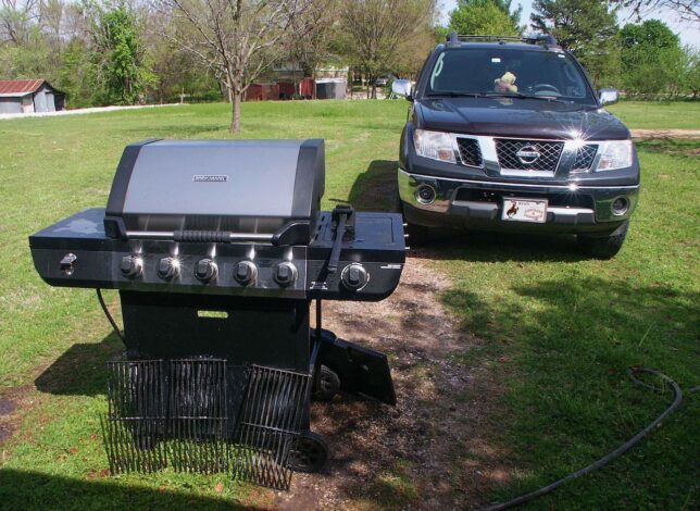 The six-burner propane grill sits in the driveway in April 2020.