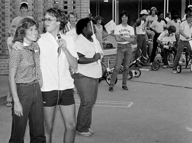 Here is an image I made in September 1980 at my high school's "trike races" event. On the left is Jena Owrey, who was always sweet to me in school. I have lost track of her. In the back on the right is Jeff Glenn, my college roommate who killed himself a couple of years later.