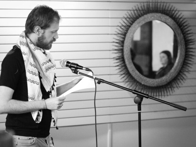 Event organizer Cody Baggerly got the night started by reading one of his poems.