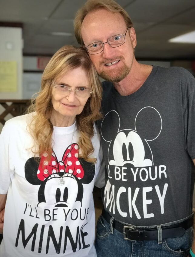 Abby and Richard smile after getting their hair cut together in September 2020. The t-shirts were a gift from Abby's daughter Chele.