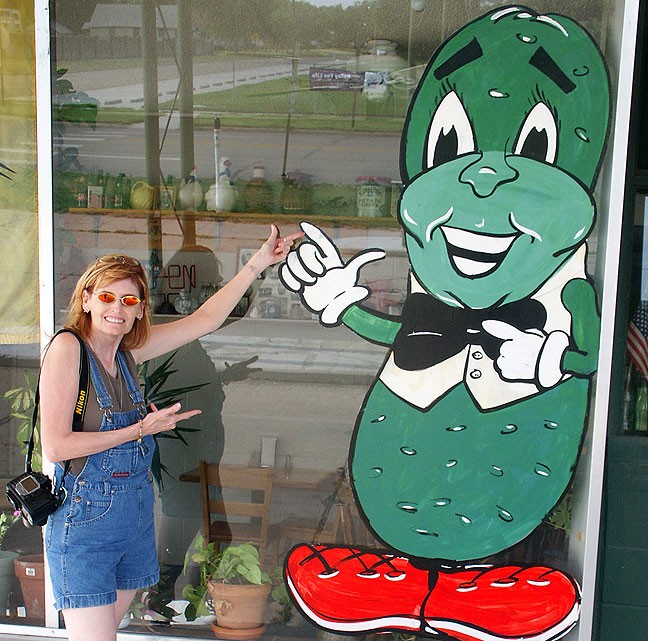 Abby poses at The Chubby Pickle on a roadside in Kansas.