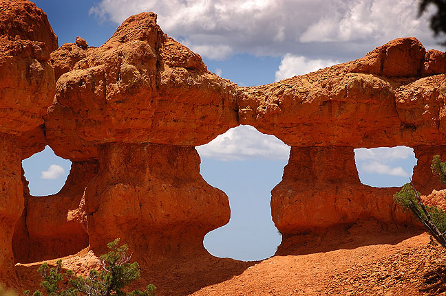 These hoodoos in Red Canyon form a unique triple arch.
