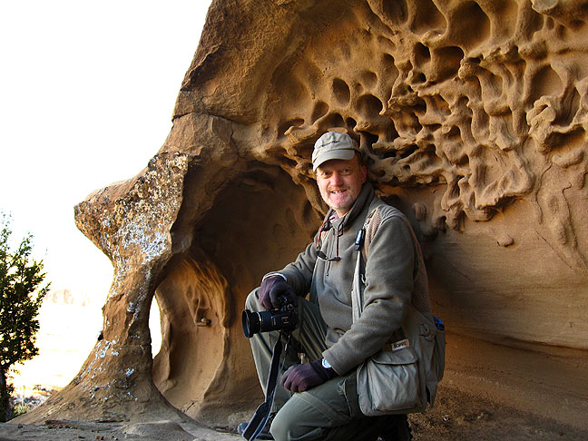 Your host poses in an eroded alcove on the switchbacks up the South Mesa trail.