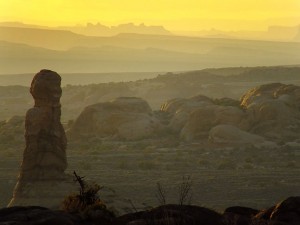 This supertelephoto sunset view looks west across Arches National Park.