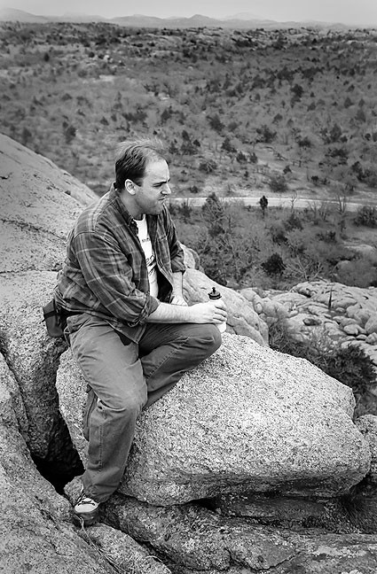 David Martin rests during a hike near Bat Cave Mountain, 1995.