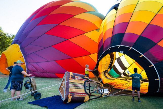 Balloon crews use fans to partially fill their balloon prior to heating them with their propane burners.
