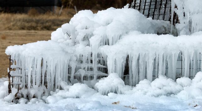 Thick ice clings to the base of the fountain.